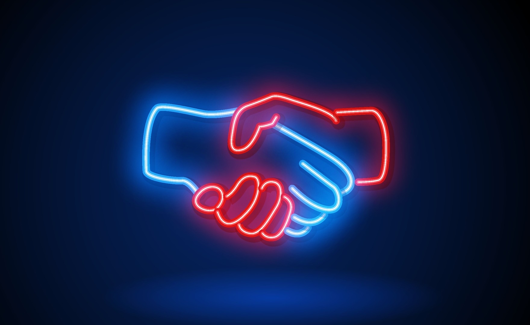Image of neon lit hands shaking one another