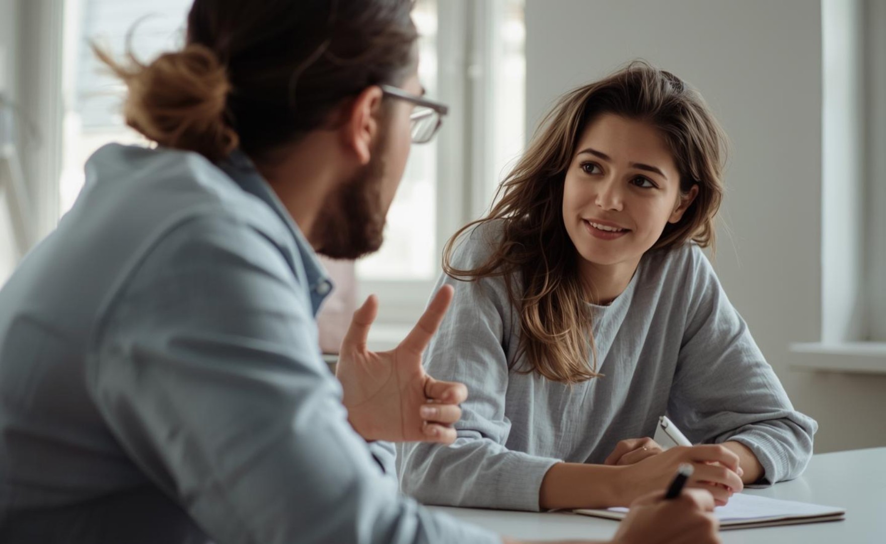 Image of two individuals in conversation