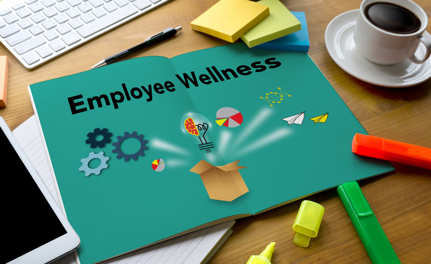 Book on desk with pages open reading employee wellness